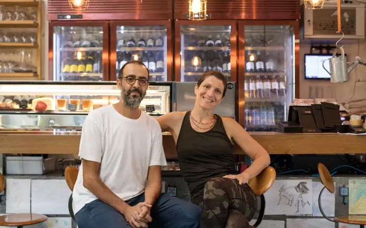 Two owners of a small business at their counter
